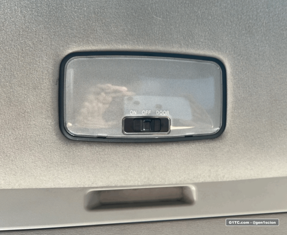 black OEM Toyota rear dome light housing for interior blackout project