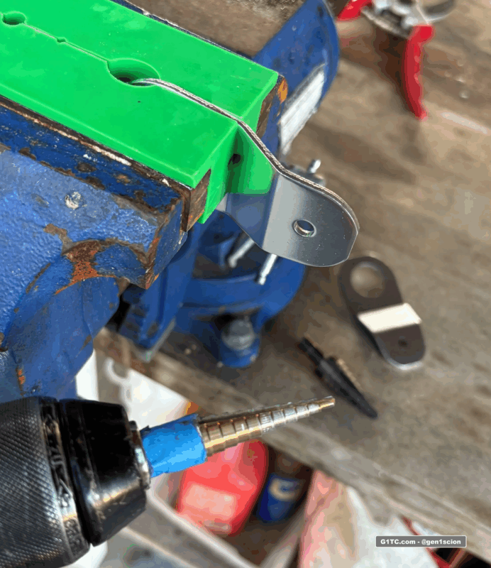 cutting bigger mounting hole in civic ek bracket to fit scion tc