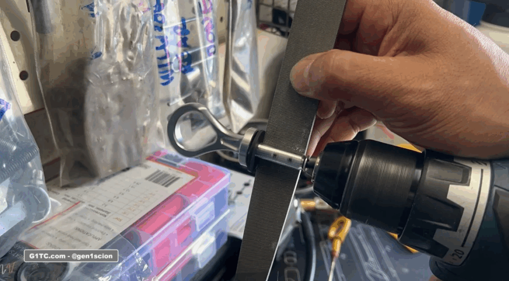 hand filing the width on custom oil dipstick handle with drill chuck