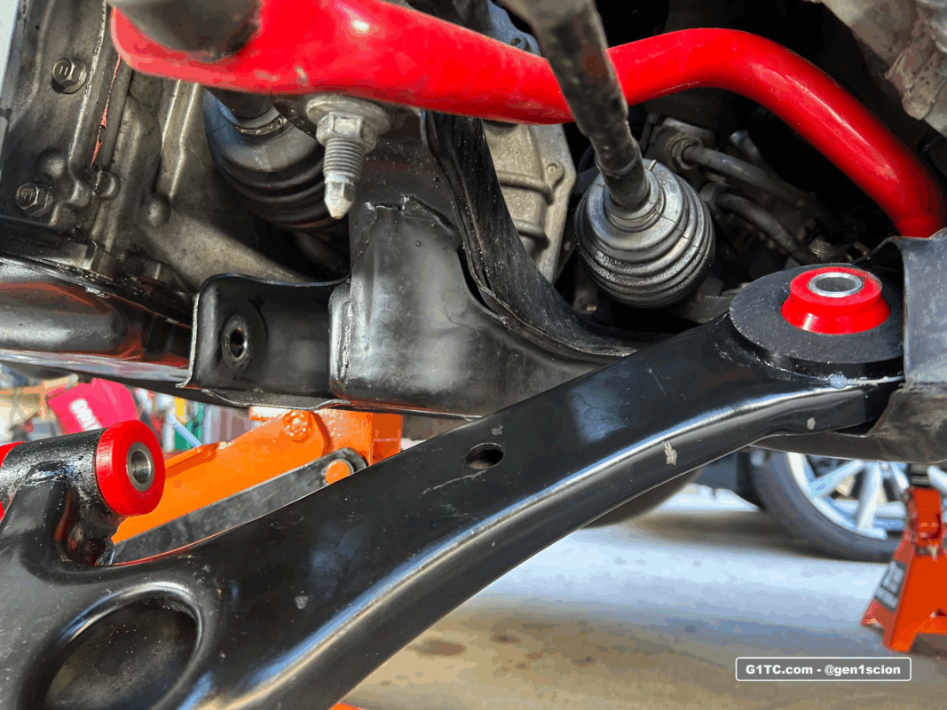 installing the lower control arm with new polyurethane bushings on 1st gen scion tc