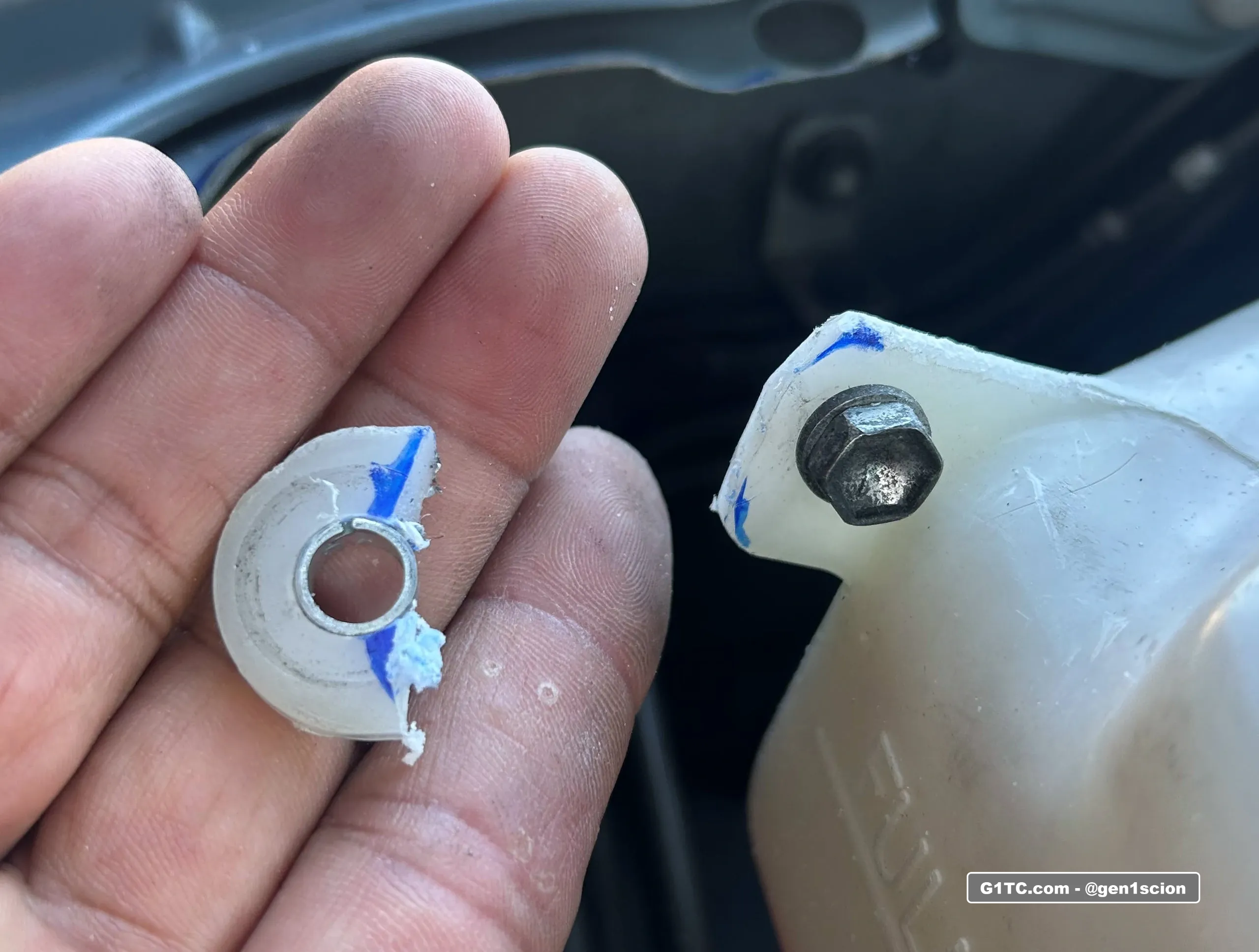 modifying the expansion tank tab to make room for dual hood strut