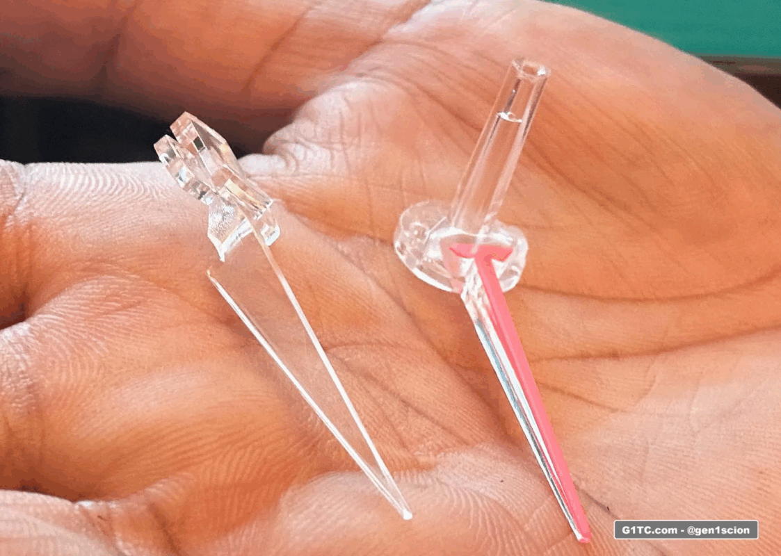 OEM needle with amber removed compared to actual red needle