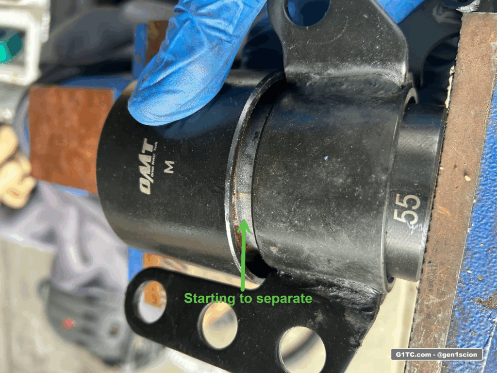 pressing out the rear training arm bushing with 55mm disc