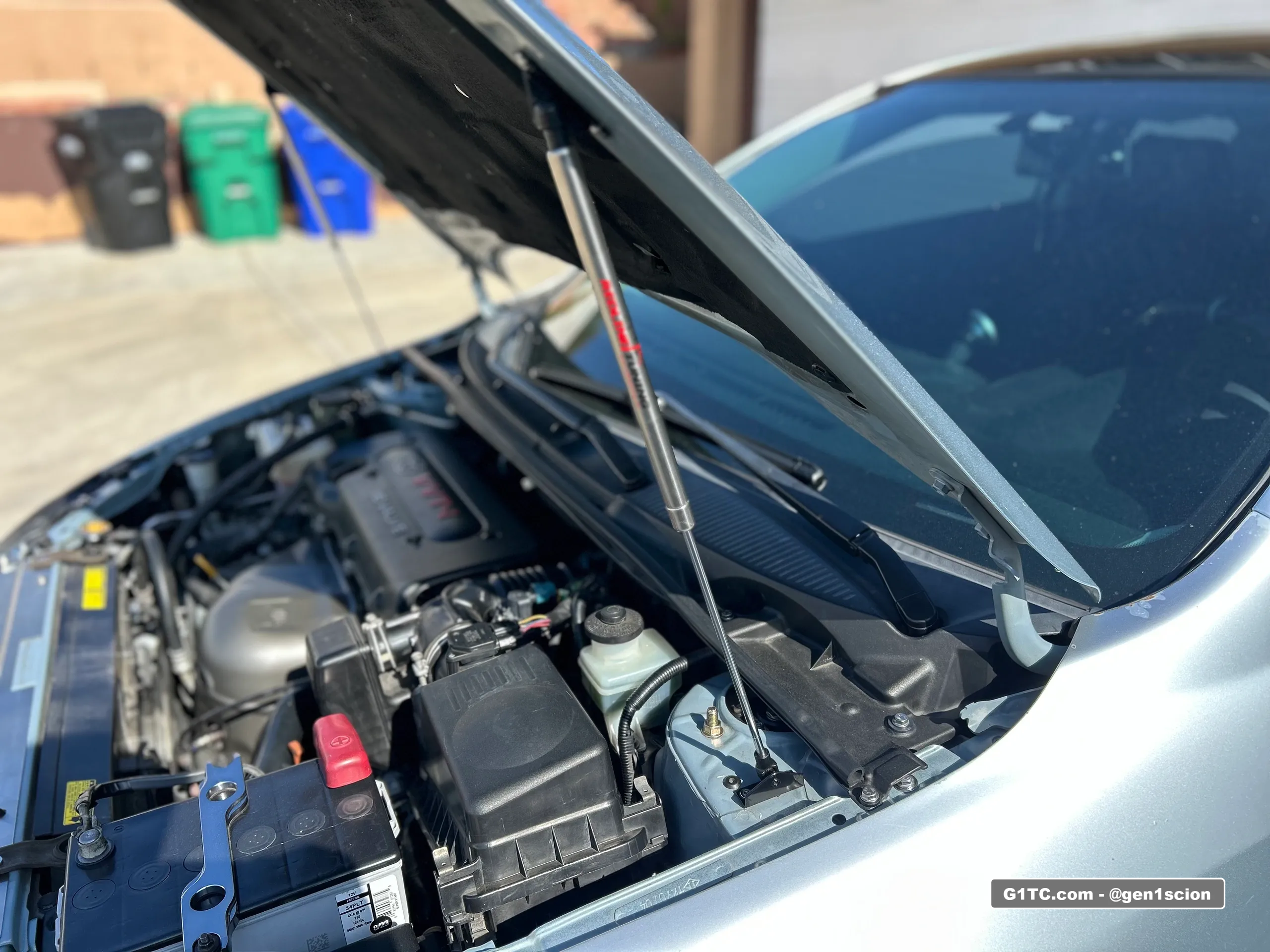 redline tuning custom dual hood strut install for 2005-2010 scion tc