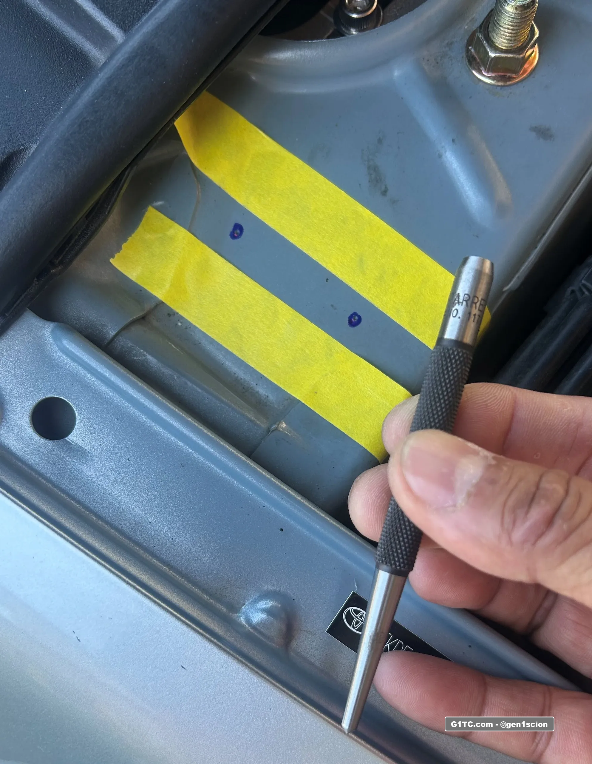 redline tuning hood strut install using punch to start hole drilling