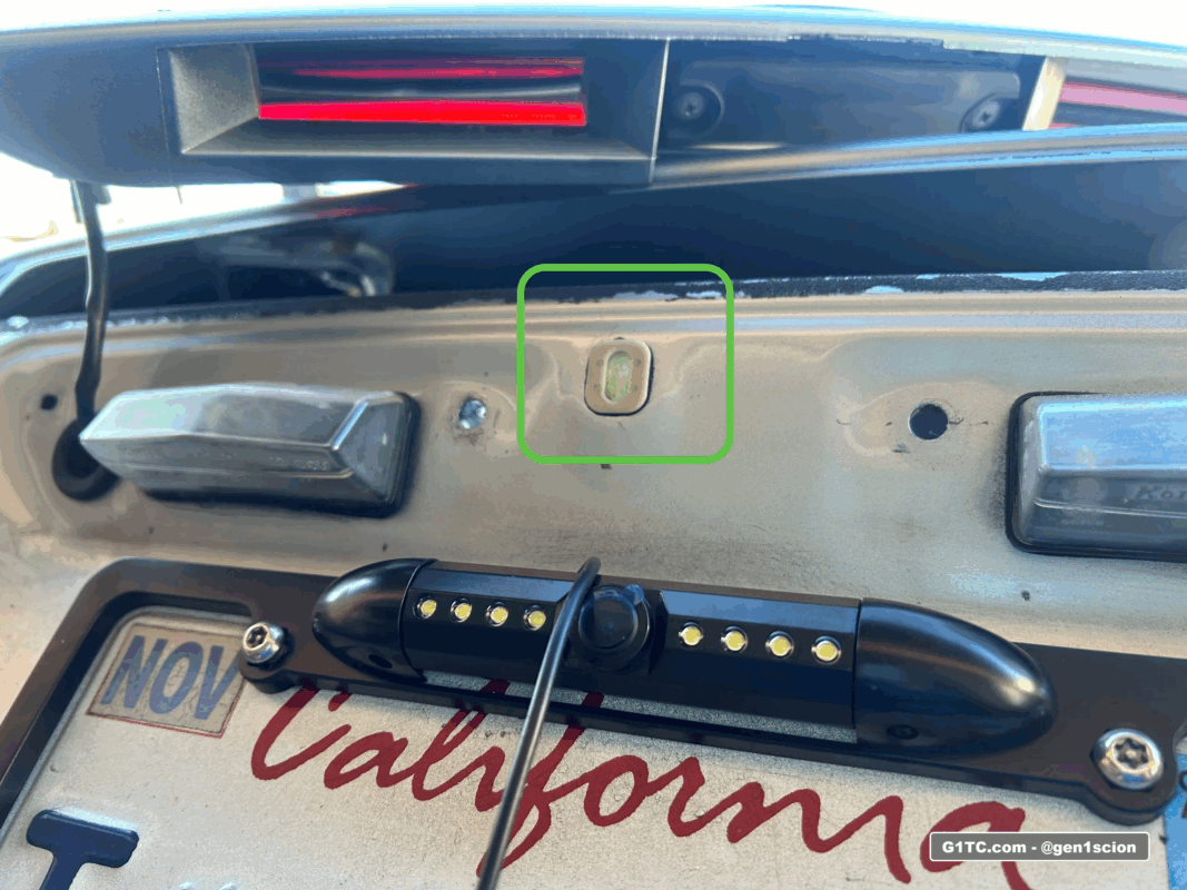 routing the reverse backup camera license plate frame mount wire through center hole