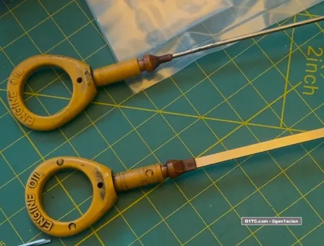 two styles of dip stick rods flat and round