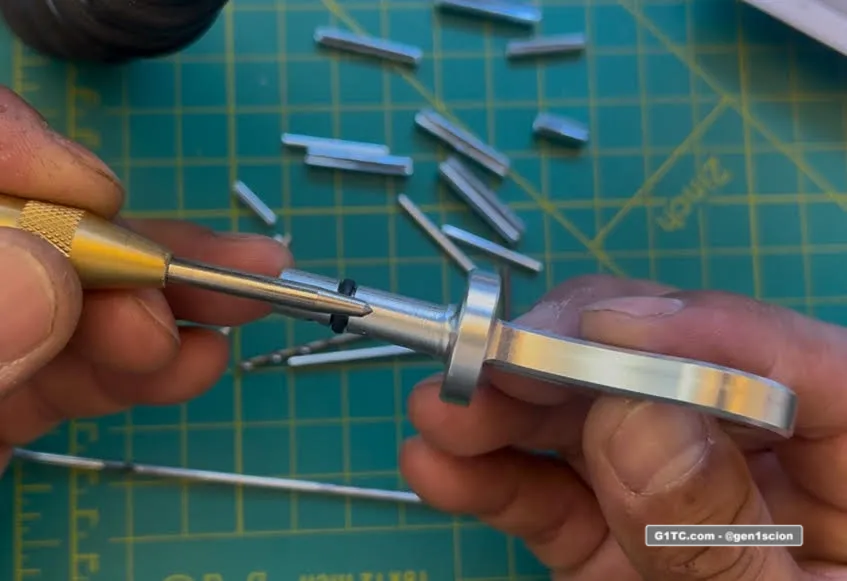 using a punch to drill hole in custom billet oil dipstick handle